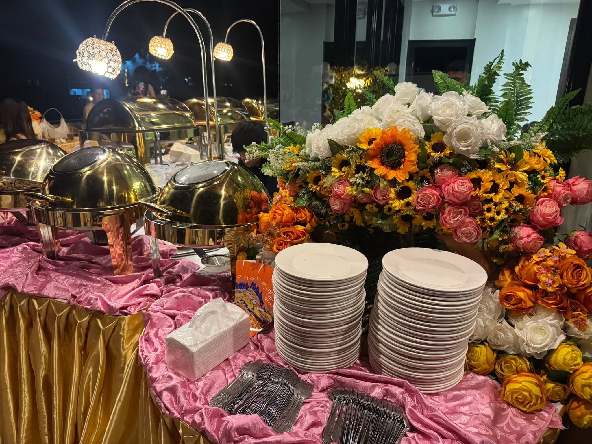 A colorful CFH buffet styled with flowers and polished tableware